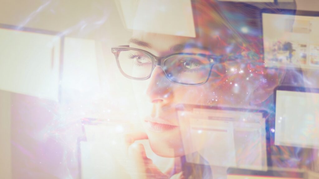 A woman staring at multiple screens, looking bewildered as she works through the challenges of building a site with Elementor