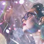 Woman gazing upward amid soft lights, reflecting quietly at the threshold of a New Year